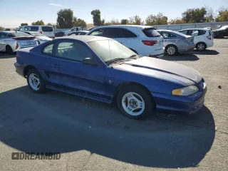 1996 Ford Mustang with VIN 1FALP404XTF190707, listed as a Copart auction lot 79583054 with 197,695 mi miles and Salvage Title. Bid and sale history available at carsss.com. Image 4.