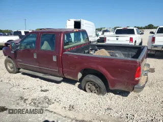 2000 Ford F-350 XL with VIN 1FTSW30F6YEB89796, listed as a Copart auction lot 67490144 with 517,242 mi miles and Salvage Title. Bid and sale history available at DreamBid. Image 2.