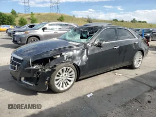 2014 Cadillac CTS Luxury AWD with VIN 1G6AX5SX6E0194695, listed as a Copart auction lot 63860695 with 144,763 mi miles and Salvage title. Bid and sale history available at DreamBid. Image 1.