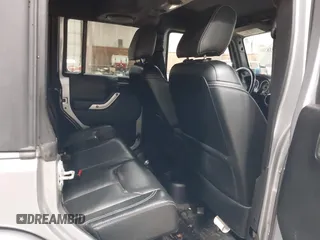 2014 Jeep Wrangler Unlimited Sahara with VIN 1C4BJWEG5EL164350, listed as a IAAI auction lot 42018586 with 113,222 mi miles. Bid and sale history available at carsss.com. Image 8.
