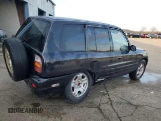 1999 Toyota RAV4 with VIN JT3GP10V9X7042801, listed as a Copart auction lot 82712874 with 256,151 mi miles and Salvage Title. Bid and sale history available at DreamBid. Image 3.
