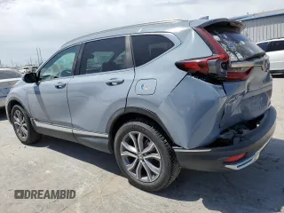 2020 Honda CR-V Touring z VIN 7FART6H93LE013954, wystawiony jako Copart lot #56970555 z przebiegiem 134 931 mil mil oraz Szkoda całkowita • Salvage title. Historia ofert i sprzedaży dostępna na DreamBid. Obrazek 2.