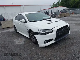 2015 Mitsubishi Lancer SE z VIN JA32V2FW8FU006744, wystawiony jako IAAI lot #42435279 z przebiegiem Nie podano mil oraz . Historia ofert i sprzedaży dostępna na DreamBid. Obrazek 1.