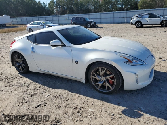 2014 Nissan 370Z Touring with VIN JN1AZ4EH1EM635411, listed as a Copart auction lot 82670344 with 77,501 mi miles and Salvage Title. Bid and sale history available at carsss.com. Image 4.