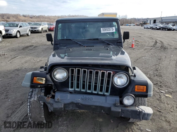 2002 Jeep Wrangler Sport with VIN 1J4FA49S32P758082, listed as a Copart auction lot 80692073 with 148,784 mi miles and Salvage Title. Bid and sale history available at carsss.com. Image 5.