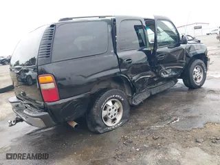 2003 Chevrolet Tahoe LS with VIN 1GNEC13Z73R243308, listed as a IAAI auction lot 41510266 with 246,378 mi miles. Bid and sale history available at carsss.com. Image 4.
