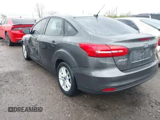 2015 Ford Focus SE with VIN 1FADP3F28FL219552, listed as a IAAI auction lot 41959648 with 128,590 mi miles. Bid and sale history available at carsss.com. Image 3.