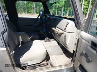 2003 Jeep Wrangler Sport z VIN 1J4FA49S13P313180, wystawiony jako IAAI lot #42349673 z przebiegiem 141 073 mil mil oraz . Historia ofert i sprzedaży dostępna na DreamBid. Obrazek 5.