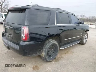2016 GMC Yukon SLT with VIN 1GKS1BKC3GR272738, listed as a IAAI auction lot 41712439 with 169,726 mi miles. Bid and sale history available at carsss.com. Image 4.