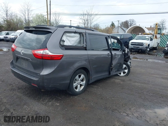 2015 Toyota Sienna LE AAS with VIN 5TDKK3DC1FS615090, listed as a IAAI auction lot 41965112 with 116,745 mi miles. Bid and sale history available at carsss.com. Image 4.