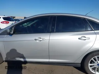 2018 Ford Focus SE z VIN 1FADP3F27JL204873, wystawiony jako IAAI lot #41657504 z przebiegiem 99 224 mil mil oraz . Historia ofert i sprzedaży dostępna na DreamBid. Obrazek 14.