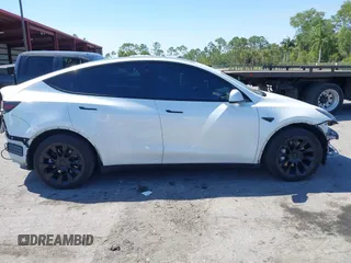 2022 Tesla Model Y Long Range with VIN 7SAYGAEE8NF431786, listed as a IAAI auction lot 41750353 with 67,846 mi miles and . Bid and sale history available at carsss.com. Image 14.
