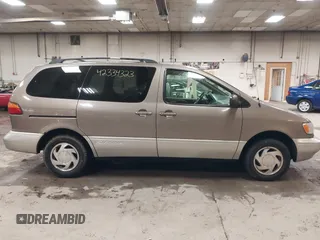 1999 Toyota Sienna LE z VIN 4T3ZF13CXXU127488, wystawiony jako IAAI lot #42334323 z przebiegiem 247 917 mil mil oraz . Historia ofert i sprzedaży dostępna na DreamBid. Obrazek 14.