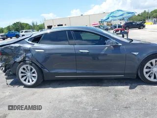 2016 Tesla Model S 70 with VIN 5YJSA1E16GF156312, listed as a IAAI auction lot 42469451 with 90,317 mi miles and . Bid and sale history available at DreamBid. Image 14.