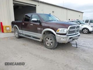 2013 Ram 2500 Laramie with VIN 3C6UR5FL0DG584754, listed as a IAAI auction lot 41474440 with 115,804 mi miles and . Bid and sale history available at DreamBid. Image 1.