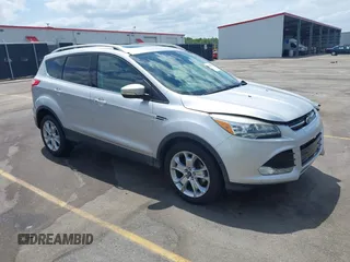 2014 Ford Escape Titanium with VIN 1FMCU0JX7EUA28824, listed as a IAAI auction lot 42065325 with 107,761 mi miles. Bid and sale history available at carsss.com. Image 1.