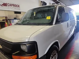 2014 Chevrolet Express Cargo Van with VIN 1GCSGAFX3E1159546, listed as a IAAI auction lot 42192001 with 286,288 mi miles. Bid and sale history available at carsss.com. Image 1.