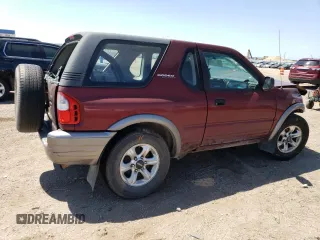 2002 Isuzu Rodeo z VIN 4S2CK57W324328446, wystawiony jako Copart lot #58097174 z przebiegiem 118 514 mil mil oraz Szkody całkowita. Historia ofert i sprzedaży dostępna na DreamBid. Obrazek 3.
