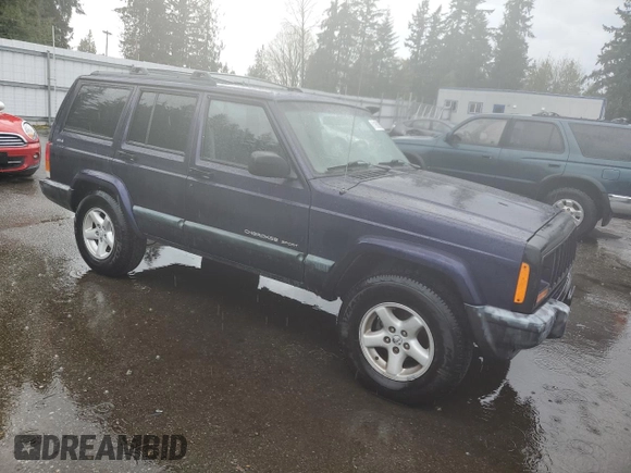1999 Jeep Cherokee Sport with VIN 1J4FF68S6XL602177, listed as a Copart auction lot 51962355 with 176,386 mi miles and Salvage Title. Bid and sale history available at carsss.com. Image 4.