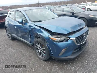 2018 Mazda CX-3 Touring with VIN JM1DKFC78J0322460, listed as a IAAI auction lot 41730662 with 58,841 mi miles. Bid and sale history available at carsss.com. Image 1.