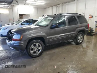 2004 Jeep Grand Cherokee Limited with VIN 1J8GX58N84C330702, listed as a Copart auction lot 84808454 with 164,426 mi miles and Salvage Title. Bid and sale history available at DreamBid. Image 1.