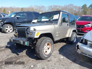 2004 Jeep Wrangler Sahara with VIN 1J4FA59S14P772264, listed as a IAAI auction lot 41814074 with 165,750 mi miles and . Bid and sale history available at DreamBid. Image 2.
