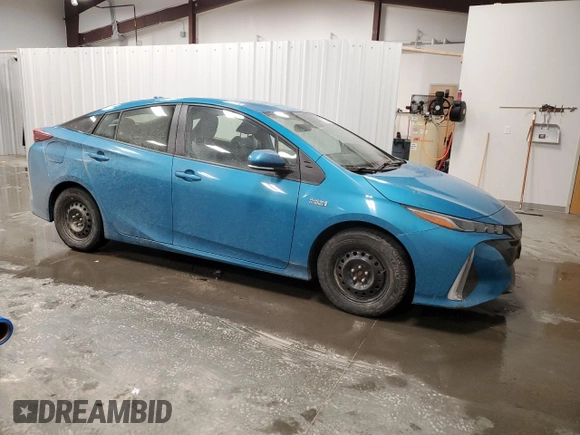 2021 Toyota Prius LE with VIN JTDKAMFP7M3186254, listed as a Copart auction lot 50225635 with 69,882 mi miles and Salvage Title. Bid and sale history available at DreamBid. Image 4.