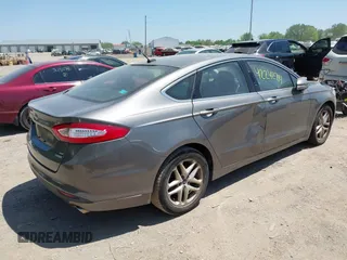 2014 Ford Fusion SE with VIN 3FA6P0HD7ER328428, listed as a IAAI auction lot 42242714 with 74,199 mi miles and . Bid and sale history available at DreamBid. Image 4.