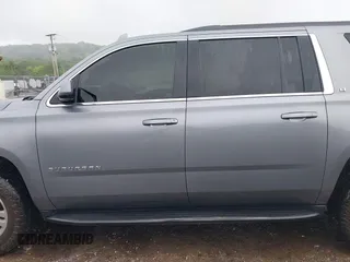 2019 Chevrolet Suburban LT with VIN 1GNSKHKCXKR405555, listed as a IAAI auction lot 42188860 with 143,435 mi miles and . Bid and sale history available at DreamBid. Image 14.