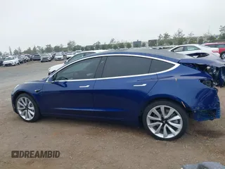 2020 Tesla Model 3 Standard Range Plus with VIN 5YJ3E1EA1LF802648, listed as a IAAI auction lot 42208034 with 27,231 mi miles and . Bid and sale history available at DreamBid. Image 14.