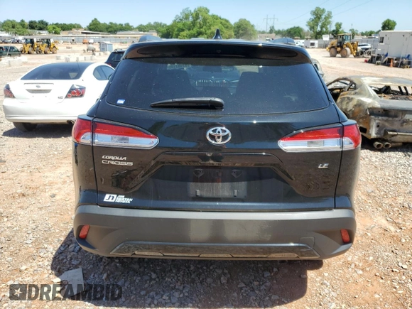 2023 Toyota Corolla Cross LE with VIN 7MUCAAAG3PV058094, listed as a Copart auction lot 57983105 with 30,593 mi miles and Salvage title. Bid and sale history available at DreamBid. Image 6.