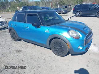 2016 MINI Cooper Hardtop 4 Door S with VIN WMWXU3C57G2D29384, listed as a IAAI auction lot 41879994 with 113,524 mi miles. Bid and sale history available at carsss.com. Image 1.
