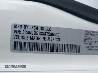 2021 Jeep Compass Altitude with VIN 3C4NJDBBXMT586529, listed as a IAAI auction lot 42296016 with 71,789 mi miles and . Bid and sale history available at DreamBid. Image 9.