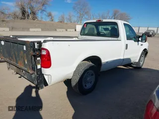 2002 Ford Super Duty F-250 XL with VIN 1FTNF20L12EB69721, listed as a IAAI auction lot 41324860 with 232,751 mi miles. Bid and sale history available at carsss.com. Image 4.