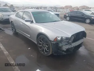 2014 Dodge Charger SE with VIN 2C3CDXBG8EH268788, listed as a IAAI auction lot 41223495 with 115,048 mi miles. Bid and sale history available at carsss.com. Image 1.