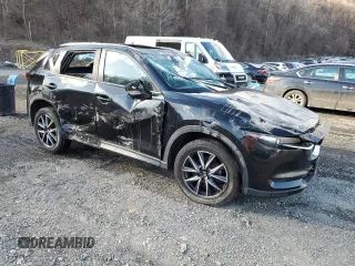 2018 Mazda CX-5 Touring with VIN JM3KFBCM3J0382258, listed as a Copart auction lot 50463005 with 61,887 mi miles and Salvage Title. Bid and sale history available at carsss.com. Image 4.