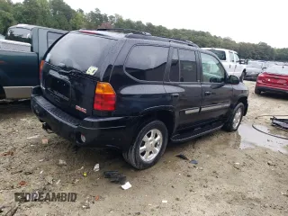 2004 GMC Envoy SLT with VIN 1GKDT13S942279670, listed as a Copart auction lot 73527974 with 120,425 mi miles and Salvage Title. Bid and sale history available at DreamBid. Image 3.