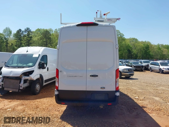 2021 Ford Transit Cargo z VIN 1FTBW3X88MKA42155, wystawiony jako IAAI lot #41988889 z przebiegiem 74 643 mil mil oraz . Historia ofert i sprzedaży dostępna na DreamBid. Obrazek 17.