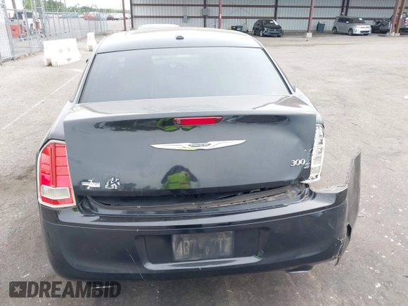 2013 Chrysler 300 with VIN 2C3CCABT2DH735764, listed as a IAAI auction lot 41977616 with 164,517 mi miles. Bid and sale history available at carsss.com. Image 16.