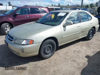 1999 Nissan Altima XE with VIN 1N4DL01D6XC179556, listed as a IAAI auction lot 41783234 with 129,064 mi miles. Bid and sale history available at carsss.com. Image 2.