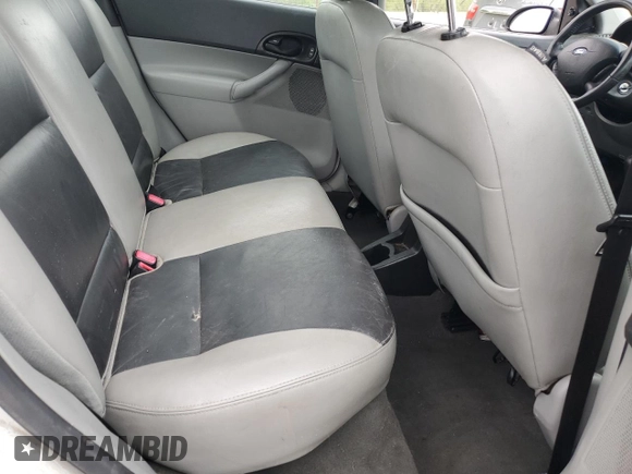 2007 Ford Focus S z VIN 1FAHP34N57W223198, wystawiony jako Copart lot #55725345 z przebiegiem 174 833 mil mil oraz Szkoda całkowita • Salvage title. Historia ofert i sprzedaży dostępna na DreamBid. Obrazek 10.