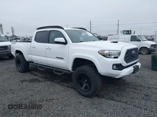 2020 Toyota Tacoma SR5 with VIN 3TMDZ5BN0LM081130, listed as a IAAI auction lot 40945589 with 57,604 mi miles and . Bid and sale history available at DreamBid. Image 1.