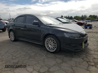 2009 Mitsubishi Lancer ES with VIN JA3AU26U49U002269, listed as a Copart auction lot 73992004 with 144,134 mi miles and Salvage Title. Bid and sale history available at DreamBid. Image 4.