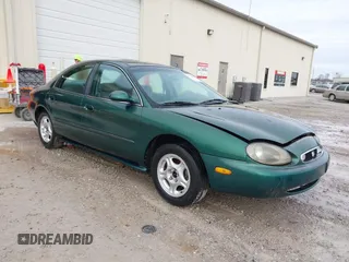 1999 Mercury Sable GS with VIN 1MEFM50U5XG633589, listed as a IAAI auction lot 41614442 with 241,833 mi miles. Bid and sale history available at carsss.com. Image 1.