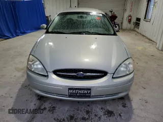 2003 Ford Taurus SE Standard z VIN 1FAFP532X3A195612, wystawiony jako Copart lot #54016645 z przebiegiem 143 168 mil mil oraz Szkoda całkowita • Salvage title. Historia ofert i sprzedaży dostępna na DreamBid. Obrazek 5.