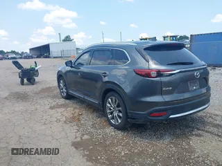 2018 Mazda CX-9 Grand Touring with VIN JM3TCADY7J0217595, listed as a IAAI auction lot 42381331 with 130,604 mi miles and . Bid and sale history available at DreamBid. Image 3.