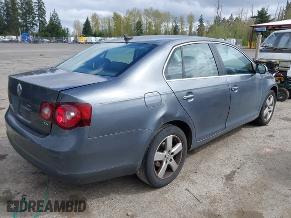 2009 Volkswagen Jetta Sedan SE with VIN 3VWRM71K59M069259, listed as a IAAI auction lot 41818850 with 164,157 mi miles. Bid and sale history available at carsss.com. Image 4.