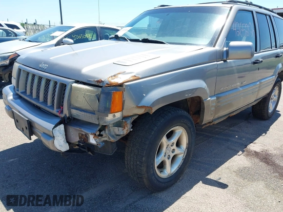 1998 Jeep Grand Cherokee Limited z VIN 1J4GZ88Z4WC328450, wystawiony jako IAAI lot #42652126 z przebiegiem 166 576 mil mil oraz . Historia ofert i sprzedaży dostępna na DreamBid. Obrazek 6.