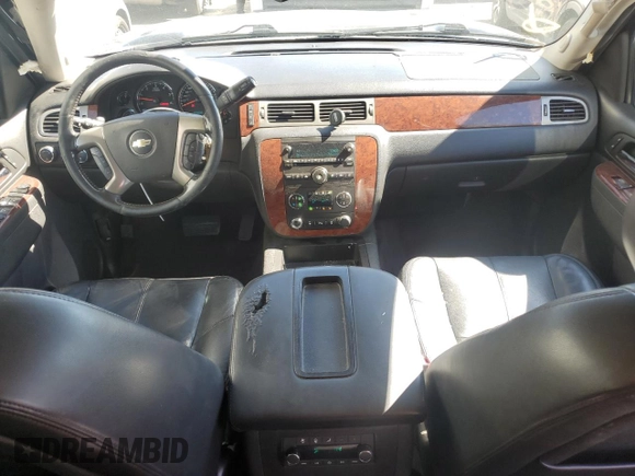 2014 Chevrolet Suburban LT with VIN 1GNSKJE71ER227075, listed as a Copart auction lot 76675654 with 214,113 mi miles and Salvage Title. Bid and sale history available at DreamBid. Image 8.