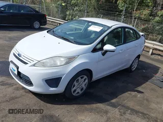 2013 Ford Fiesta S z VIN 3FADP4AJ9DM191664, wystawiony jako IAAI lot #41827196 z przebiegiem 111 982 mil mil oraz . Historia ofert i sprzedaży dostępna na DreamBid. Obrazek 2.